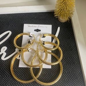 Gold tone hoop earring set.